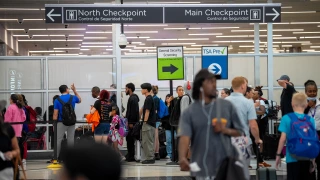 Travelers stand in a long line for security screening at Hartsfield-Jackson Atlanta International Airport on June 28, 2024 in Atlanta, Georgia. The Transportation Security Administration (TSA) says they are anticipating a "sustained period of high passenger volumes" that will break previous travel records.