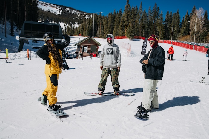 Black snowboarders
